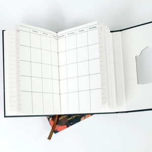 Detail of A5 floral notebook with hollow tri-fold cover, ribbon bookmark and grid inner pages