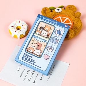 Blue Huppy Puppy stackable notebook featuring cute cartoon dog illustrations and hollow design