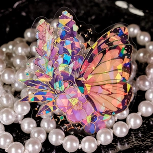 Detailed holographic fairy butterfly PET sticker with gold laser edges on black base