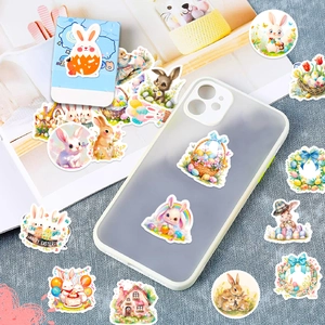 Detailed view of watercolor Easter stickers on phone case and cards for festive decoration