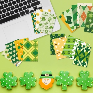 Flat lay of St. Patrick's Day themed scrapbook paper set with clovers and Irish hats