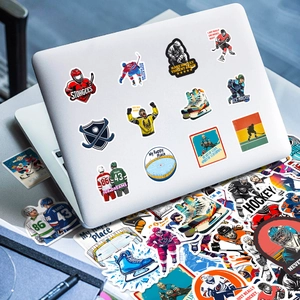 Close-up of waterproof ice hockey stickers applied on a silver laptop surface