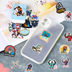 Close-up of ice hockey stickers on a phone case over a blue textured background