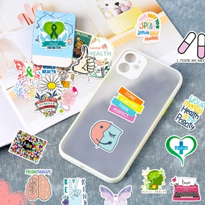 Detail of colorful mental health stickers on phone case and textured background
