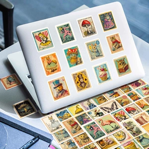 Detail of vintage stamp style rabbit stickers on a laptop and various animal decals