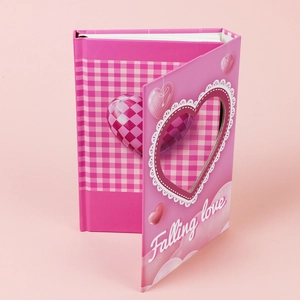 Pink heart-themed hardcover notebook with a cutout design and Falling Love text