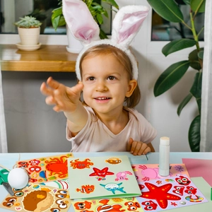 Close-up of children DIY ocean animal stickers with octopus and shark themes