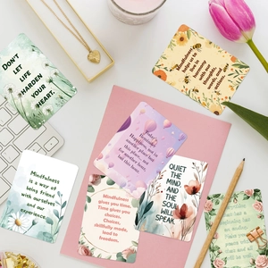 Flat lay of aesthetic mindfulness cards with floral illustrations and motivational quotes