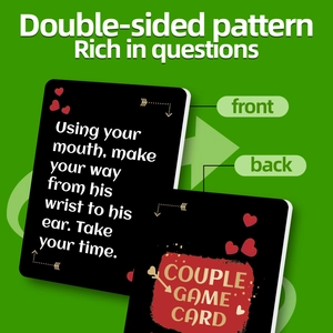 Close-up of double-sided couple game cards with heart motifs on green background