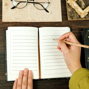 Detail of A5 fairy series notebook with lined dot grid pages and brown ribbon bookmark