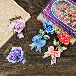 Detailed view of four vintage metal bookmarks with colorful rose floral designs