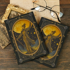 Close-up of vintage magic scepter notebooks with gold moon illustrations and hardcover