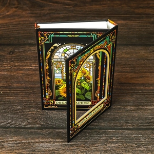 Notizbuch mit Sonnenblumen-Motiv und Dream Garden Glasdesign auf Holzuntergrund
