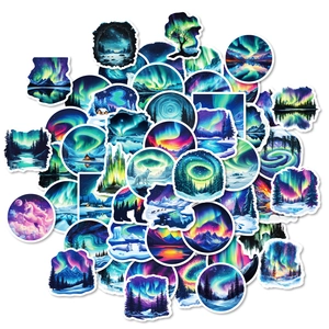 Detailed spread of 50 dream blue aurora stickers featuring snowy forests and arctic wildlife
