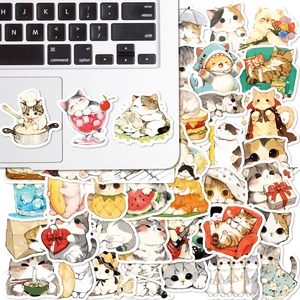 Close-up of waterproof cute cat stickers applied to a laptop keyboard for decoration