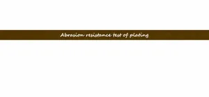 Close-up showing the abrasion resistance test results for 18K gold plating on a water wave chain