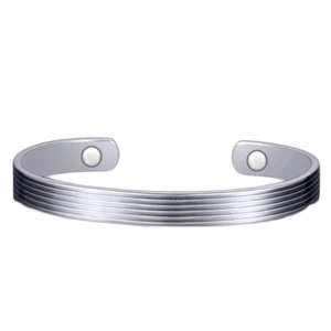 Women's magnetic therapy bracelet in white gold plated finish with parallel groove design