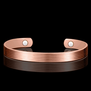 Rose gold magnetic therapy cuff bracelet with horizontal grooves and polished finish