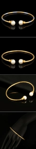 Macro detail of textured 18K gold plated cuff bracelet with round white pearls