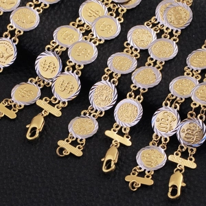 Bracelet bicolore en or 18 carats et argent avec charms de pièces et portraits