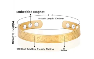 Macro shot of gold-plated copper magnetic therapy cuff with engraved Greek key patterns