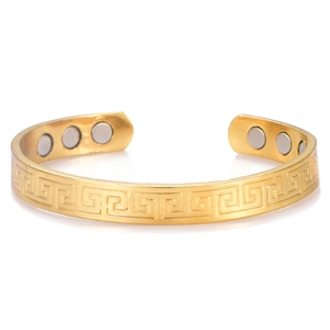 Gold plated copper magnetic therapy cuff bracelet featuring Greek meander patterns