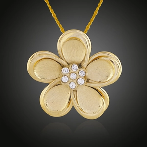 Close-up of 18K gold plated flower pendant with brushed metal petals and zircon stones