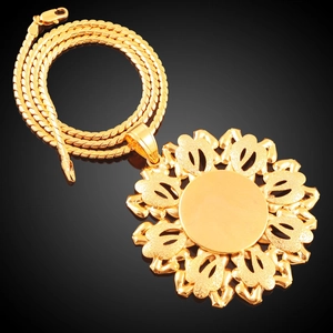 Chunky 18K gold plated sunflower pendant necklace with round snake chain on black background