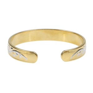 Detail of gold-plated cuff bracelet featuring silver vine patterns and beaded edges