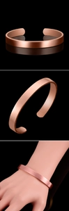 Detailed view of rose gold wide cuff bracelet with a sleek brushed metal finish