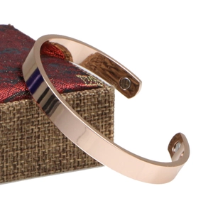 Polished rose gold magnetic copper bracelet for women on a jewelry gift box display