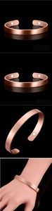 Detail of rose gold magnetic copper bracelet showing the inner magnets and polished finish