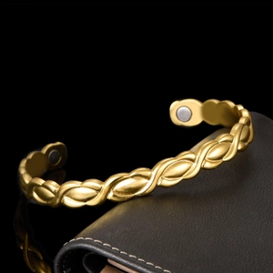 Women's 18K gold magnetic therapy cuff bracelet with twisted weave design and magnets