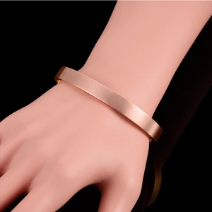 Minimalist magnetic cuff bracelet in rose gold finish for women with a sleek open design