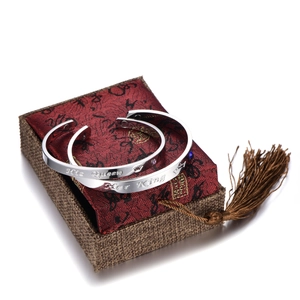 Detail of magnetic couple bracelets with His Queen and Her King crown engravings