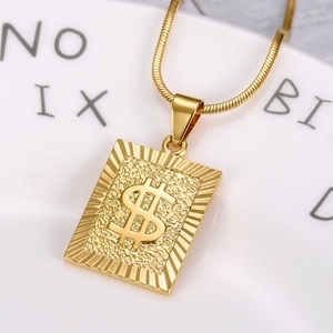 Macro shot of 18K gold plated dollar sign pendant on a sleek snake chain necklace