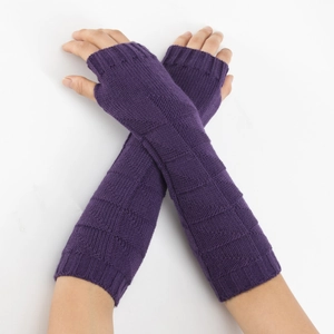 Detailed close-up of dark purple knit arm warmers showing checkerboard texture and ribbed cuffs
