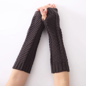 Detailed view of dark coffee knitted fingerless arm warmers with mixed stitch patterns