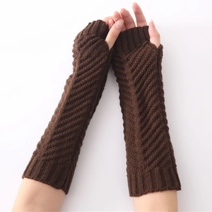 Detailed knit texture of dark brown fingerless arm warmers with thumb hole design