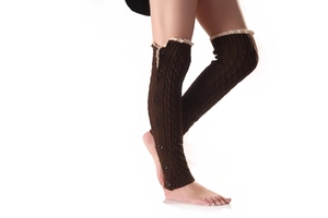Detail of dark brown cable knit leg warmers with vintage buttons and white lace trim