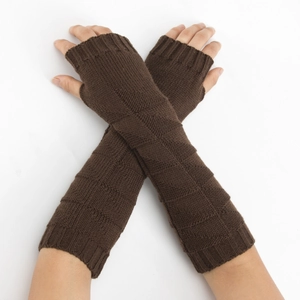 Detailed view of dark brown knitted long fingerless gloves with textured ribbing