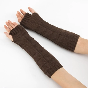 Detail view of dark brown knitted fingerless gloves with mixed texture patterns