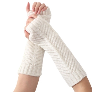 Knitted beige fingerless arm warmers with herringbone pattern and thumb holes