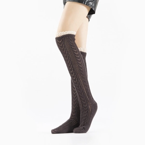 Close-up of coffee brown knit thigh high socks with hollow mesh and white lace trim