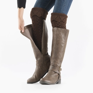 Detail of dark brown cable knit leg warmers with hollow diamond crochet pattern
