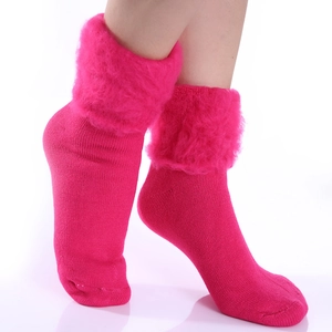 Detail of rose red thermal winter socks with thick fleece lining and knitted texture
