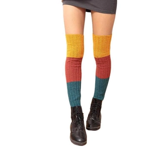 Three-color ribbed knit over-knee leg warmers in yellow, red, and dark green blocks