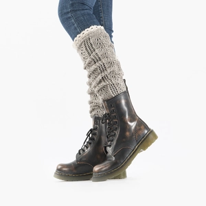 Detail of grey knitted leg warmers with white lace trim worn over blue jeans and boots