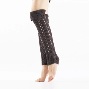Detail of coffee brown cable knit leg warmers with lace-up hollow mesh crochet patterns
