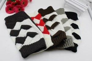 Detailed close-up of knitted arm warmers with diamond patterns in multiple colorways